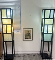 Both lamps illuminated showing design and condition