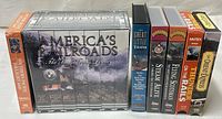 All seven VHS items lined up showing spines and boxed set