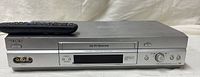 Front view of Sony SLV-N750 VHS deck with remote on top