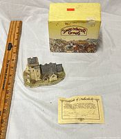 Figurine, box, ruler and COA grouped