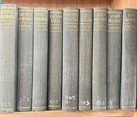 Spines of all nine volumes left view