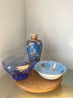 Group shot of all three items: glass bowl, ceramic bowl, vase