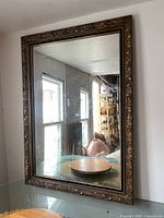 Full front view of mirror showing frame and glass