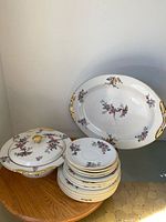 stacked plates, lidded bowl, and platter