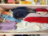 Stack of assorted towels showing colors and types