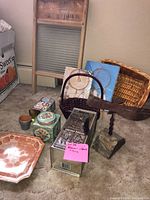Group shot showing washboard, dreamcatcher, baskets, tins, plate, planter and bird sculpture
