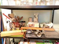 Shelf with rolling pins, grater, meat grinder, steamer, glass dishes, utensil crock and contents