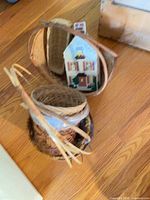 Multiple stacked baskets showing variety of shapes and materials