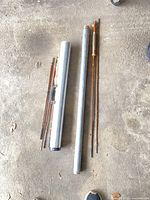 Overall view of rod sections and tubes on floor