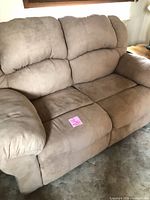 Front view of beige microfiber loveseat recliner