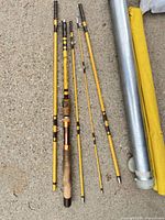 All rod sections laid out beside carry tube and fabric sleeve