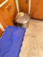 Blurry basement location showing blue bin, not used for listing details