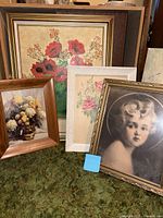 Group view of four framed prints: red poppies, chrysanthemums, pastel flowers, child portrait