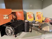 overall lot: camera, case, flash, bulb packs