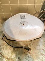 Closed top view showing George Foreman branding and power cord