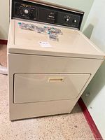 Full view of dryer front with lint traps on top