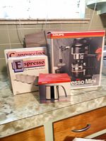 Entire lot showing Krups Espresso Mini box, two cup set boxes and Krups pitcher box