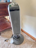 Front view of Lasko 5397 tower heater on base with power cord visible