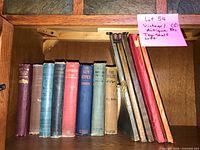 Full shelf showing all hardcover novels and board-backed yearbooks