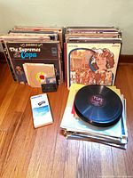 Overall lot with stacks of LPs, 45s, cassettes and Philips VHS cleaner