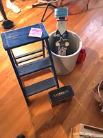 Group shot showing stool, crock, watering can, terracotta pot, Gatehouse box, patriotic figure