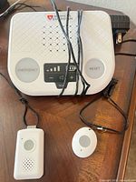 Front view of base station with two pendants and power cord visible