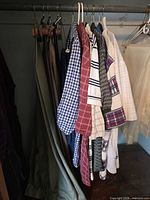 Closet view of shirts and hanging pants