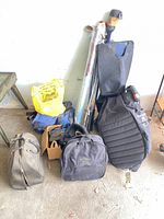 Overall lot showing golf clubs, travel bag, accessory bags and bowling bag
