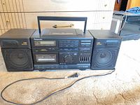 Front view of Panasonic RX-DS620 boombox with speakers and power cord