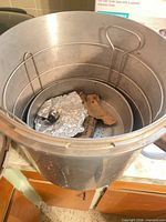 Open Presto aluminum canner showing interior, perforated rack and wire basket