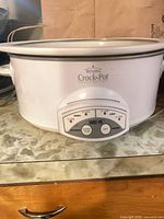 Front view of white Rival Crock-Pot base showing Smart-Pot digital control panel