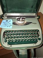 Open Royal Royalite typewriter inside case, full keyboard visible