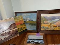 Group shot showing all four paintings together for size and variety reference