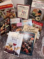 Group shot of assorted cookbooks laid out on countertop