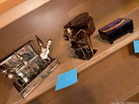 Wide shot showing three items on shelf