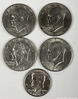 Obverse view of all five coins displaying dates and designs
