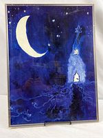 Front view of framed poster print showing crescent moon, stars and whimsical church scene