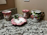Full view of four ceramic bathroom pieces on countertop