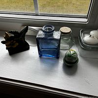 full view of decorative items on windowsill