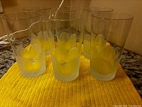 Six tumblers displayed on yellow towel