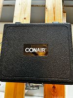 Closed black Conair case front view