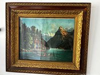 Front view showing alpine lake print and ornate wood and gilt frame