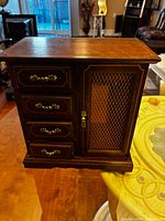 Front view showing drawers and mesh door