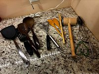 Full group of assorted utensils on countertop