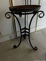 Full view of wrought iron pedestal plant stand
