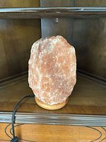 Salt lamp unlit showing overall form and base with cord