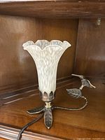 Full view of lamp showing base, hummingbird figure, and glass shade