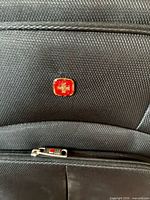 Close-up of exterior showing Swiss Gear logo and textured fabric