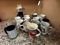 Overview of all mugs on countertop