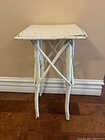 Front view of white twig accent table